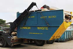 Skip Hire Bishops Stortford unloading a full skip